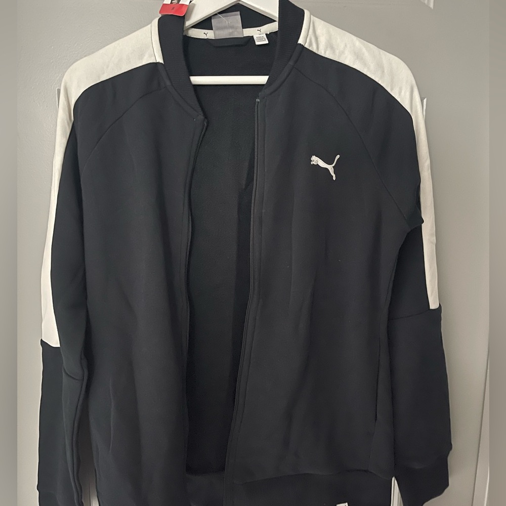 Black and white puma zip up jacket, never worn.